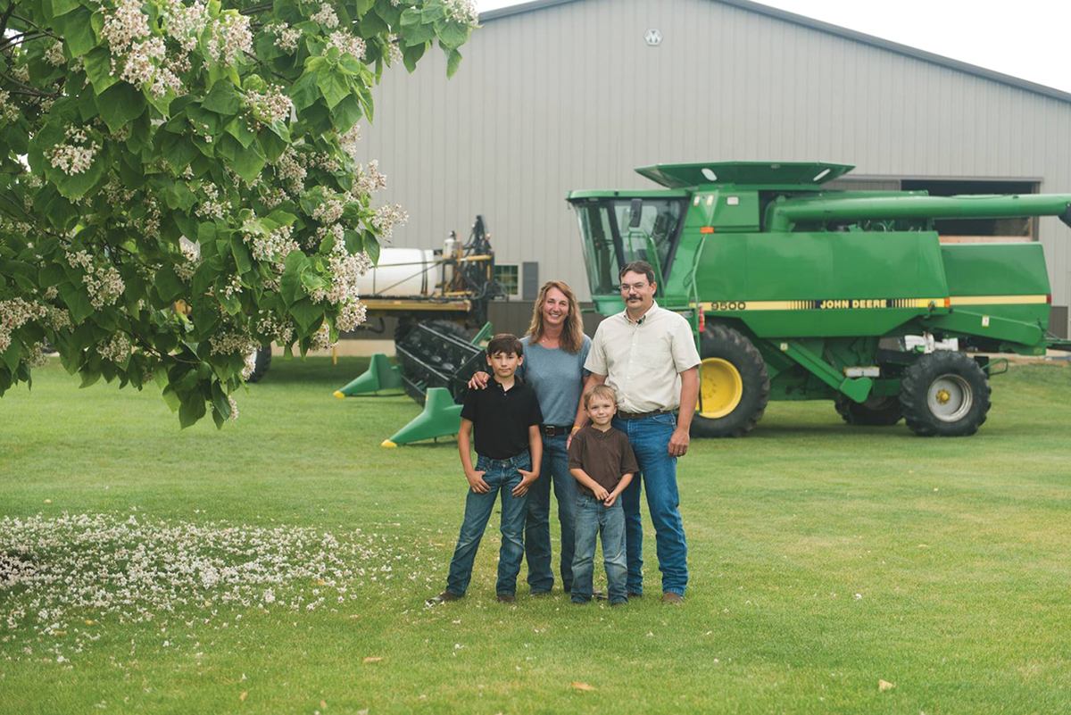 Traci Bultemeier with her family on their farm, Wayne Trace Farms, near Fort Wayne, IN. Pictured are Traci, her husband Jamie, and their boys Wyatt (now 13) and Luke (8).
