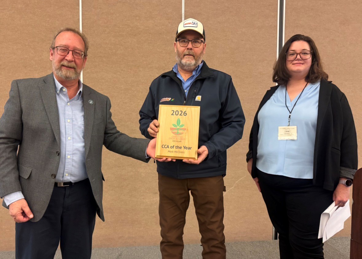 Mark McClintic (center) was named Michigan's first CCA of the Year in January 2026. On his left is Tim Schaub, Michigan CCA Board Chair, and on his right is Lara Bryant, Associate Director of Component Relations for the American Society of Agronomy. 