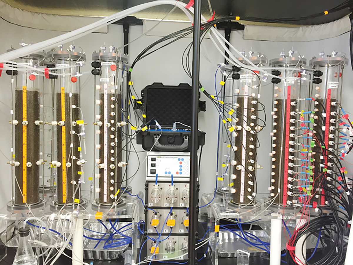 Automated fluctuating water table soil column experimental setup in which the waterlogged conditions are imposed using a computer-controlled, multi-channel pump connected to a hydrostatic equilibrium reservoir and a water storage reservoir. Photo courtesy of Adrian Mellage.