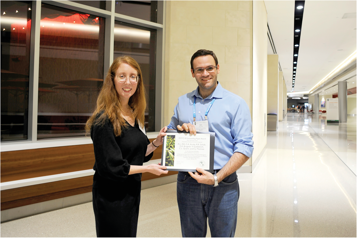 Alex Zilli accepts the 2019 Crop Science Outstanding Paper Award for CSSA Division C8 (Plant Genetic Resources) from managing editor Liz Gebhardt during the Publications Reception at last year’s Annual Meeting in San Antonio, TX. He was the lead author on the paper titled “Widening the Gene Pool of Sexual Tetraploid Bahiagrass: Generation and Reproductive Characterization of a Sexual Synthetic Tetraploid Population” (see https://doi.org/10.2135/cropsci2017.07.0457).