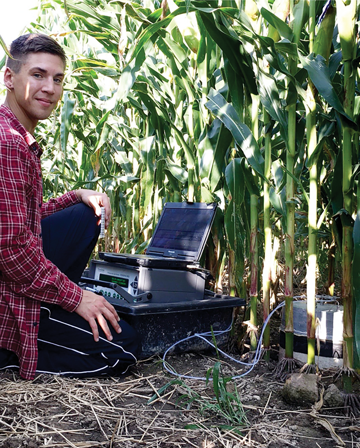 Kyle M. Dittmer capturing greenhouse gas fluxes with a photoacoustic multi-gas analyzer from a corn silage system located in Alburgh, VT. Photo courtesy of Kyle Dittmer.