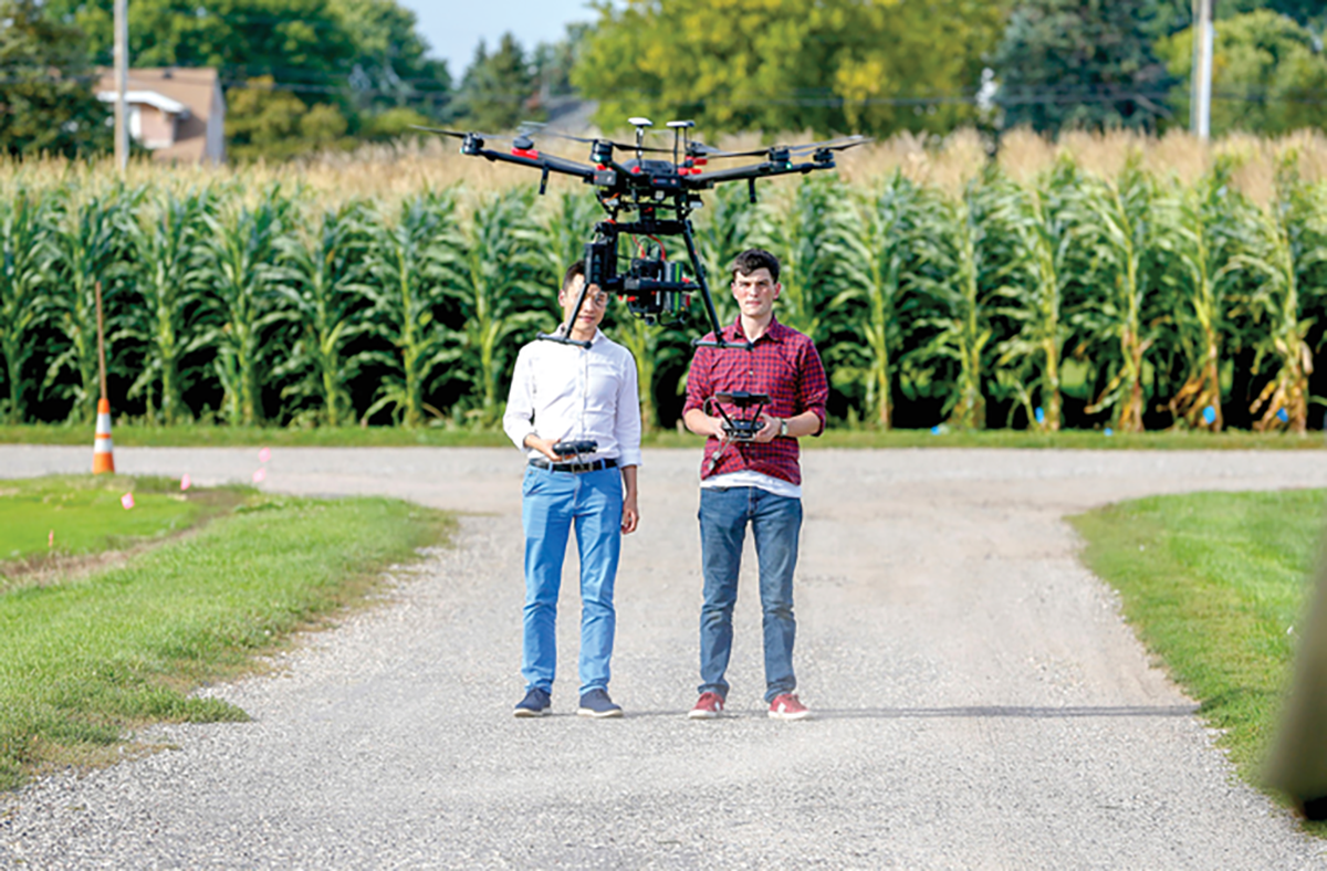 University of Minnesota (UMN) researchers test a drone equipped with sensing equipment that will be used to collect data to monitor crop health and growth. Photo courtesy of the UMN photo archive.