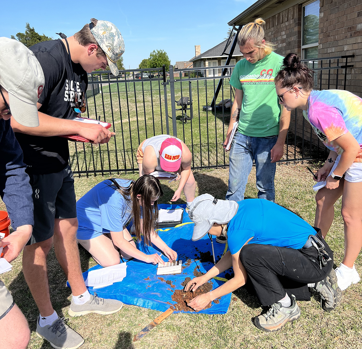 Led by University of Oklahoma Ph.D. candidate Tiffany Legg, University of Oklahoma Environmental Studies capstone students conducted soil sampling in Oklahoma City's John F. Kennedy community. Collaborating with local residents, the team addressed concerns about industrial disturbances and soil contamination. Photo by Carrie Leslie.