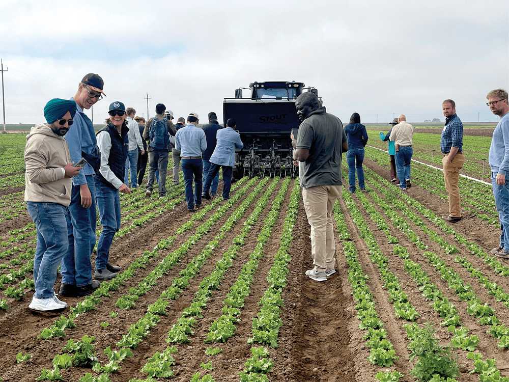 Figure 1. Meeting participants learn about automated weeding technologies on a farm in Chualar, CA.