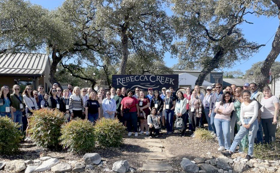 Participants of the CANVAS 2024 graduate student tour wrapping up the day at the Rebecca Creek Distillery in San Antonio, TX. Photo by Chandler Gruener.