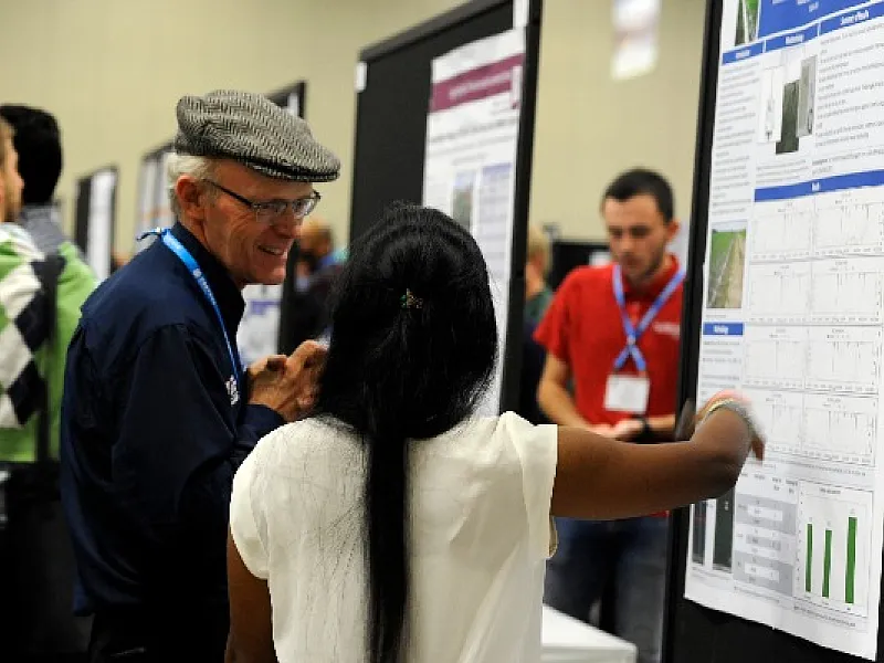 Graduate students present posters at the Annual Meeting.