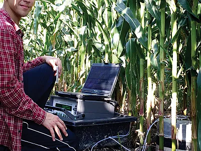 Kyle M. Dittmer capturing greenhouse gas fluxes with a photoacoustic multi-gas analyzer from a corn silage system located in Alburgh, VT. Photo courtesy of Kyle Dittmer.