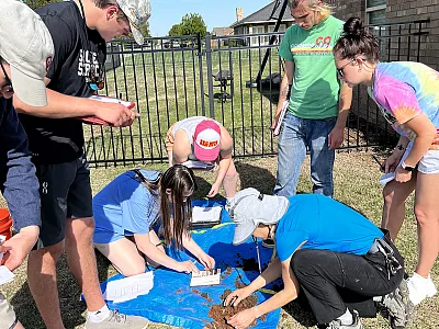 Led by University of Oklahoma Ph.D. candidate Tiffany Legg, University of Oklahoma Environmental Studies capstone students conducted soil sampling in Oklahoma City's John F. Kennedy community. Collaborating with local residents, the team addressed concerns about industrial disturbances and soil contamination. Photo by Carrie Leslie.