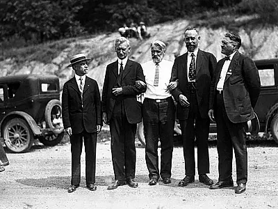 A transcontinental field tour was organized as part of the First International Congress of Soil Science, held June 13-22, 1927, in Washington, DC. This photo appears to be a field or group setting during the tour and shows Curtis F. Marbut (second from left, a U.S. pedologist who guided much of the tour) and Konstantin Glinka (middle, a soil scientist from the Soviet Union). 