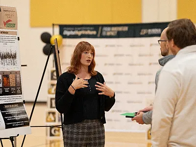 Graduate student Erin Widener presenting during the poster competition at the 2025 Symposium of Digital Agriculture at Purdue University. 