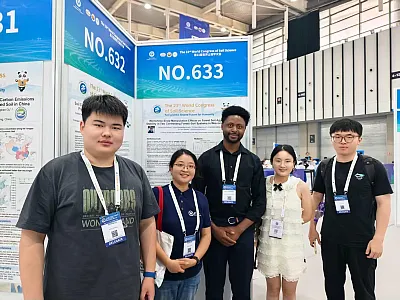 University of Wisconsin-Madison doctoral student Daniel Igirimbabazi, center, stands with international researchers in front of his research poster. Igirimbabazi shared his first season of research regarding how freeze-thaw cycles affect forest soil aggregate stability during a poster session at the conference in Nanjing, China.