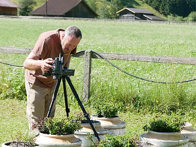 Ryan Stewart using thermal imaging to understand how critical vadose zone properties affect plant heat stress. Photo courtesy of Georg Leitinger.