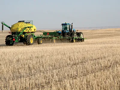 Agricultural systems in western Canada are currently dominated by no-till dryland pro- duction of spring cereal, oilseed, and pulse crops with most nitrogen fertilizer banded at the time of planting as shown here.