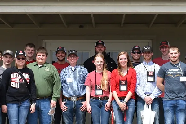 Students in a group smiling