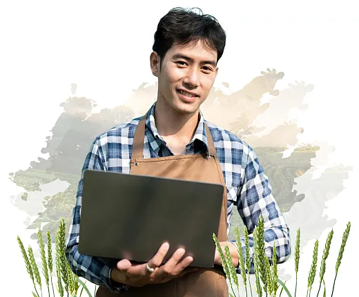 Man in overalls, holding a laptop