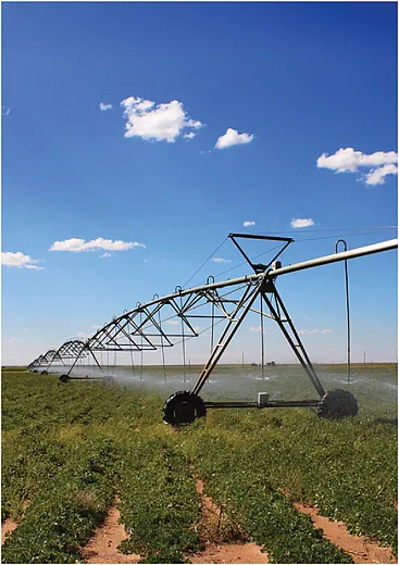 Center-pivot irrigation systems can effi- ciently water fields, allowing farmers more  control over when and how much water they apply, thus using less water overall.  Organizations like the High Plains Under- ground Water Conservation District (HPWD)  in Texas often recommend such systems to conserve water. Photo courtesy of HPWD.